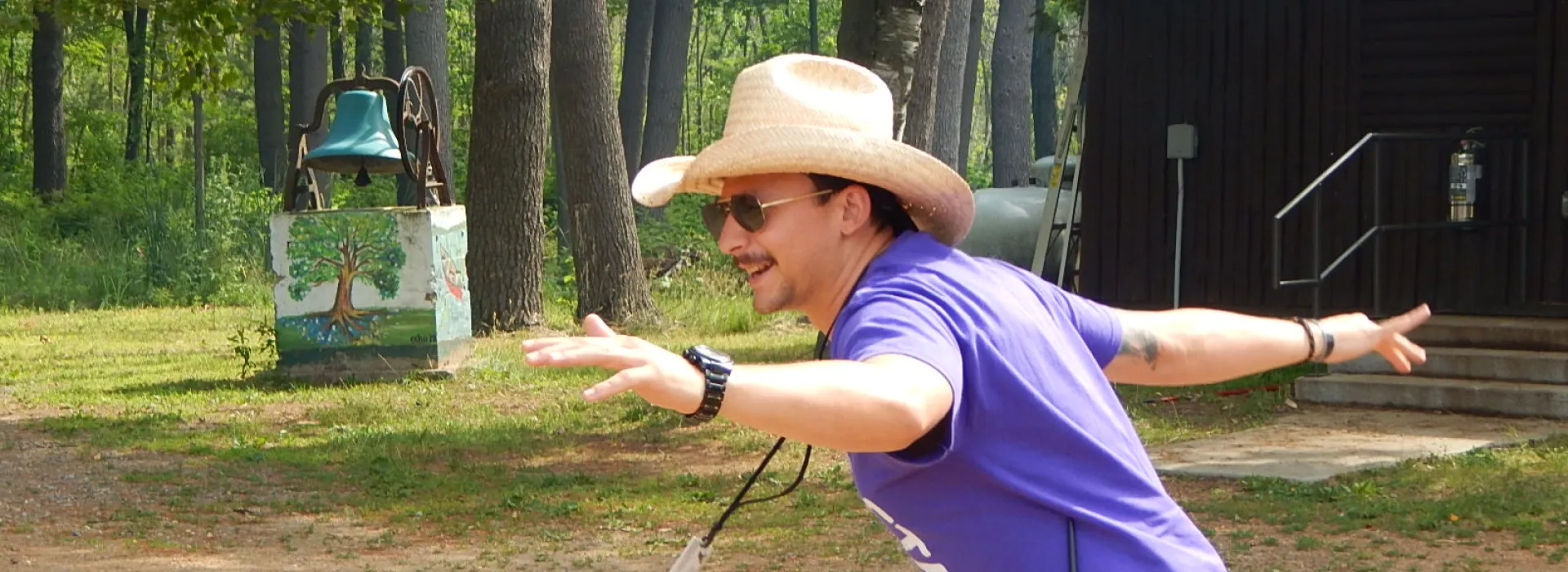 staff singing at campfire